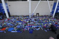 <p>Supporters pay tribute to the Leicester City owner after the crash which killed five people. Aaron Chown/PA Wire </p>