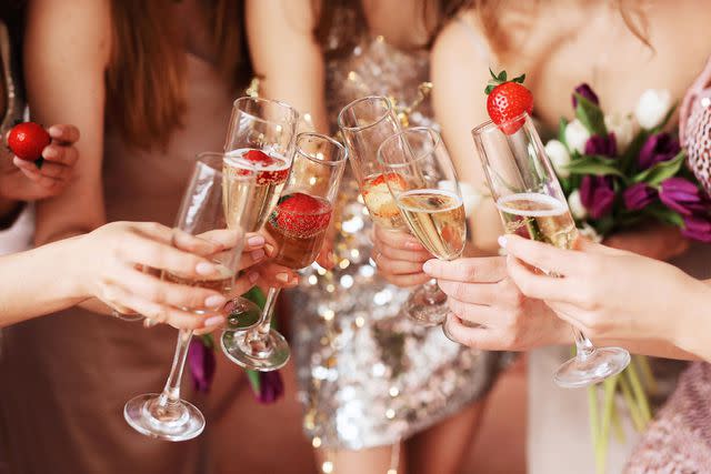 <p>Getty</p> A stock image of a champagne toast