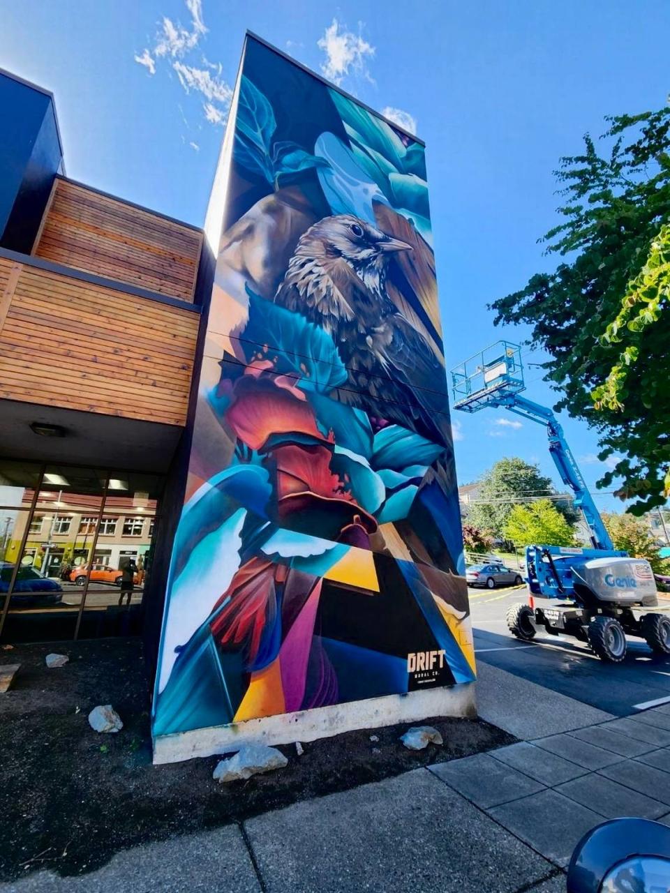 Dom LaPorte of Ottawa, Canada painted a bird and flowers on the Industrial Credit Union building at 1100 N State Street in Bellingham, Wash.