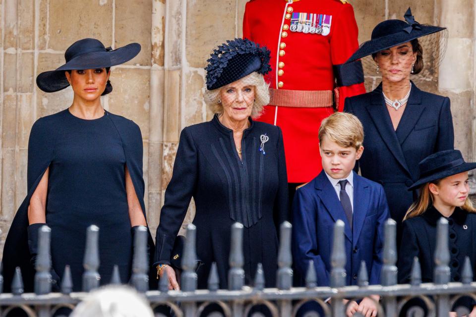 Meghan Markle, Camilla, the Queen Consort, Prince George, Princess Charlotte, and Kate Middleton during the State Funeral of Queen Elizabeth II at Westminster Abbey on September 19, 2022 in London, England.