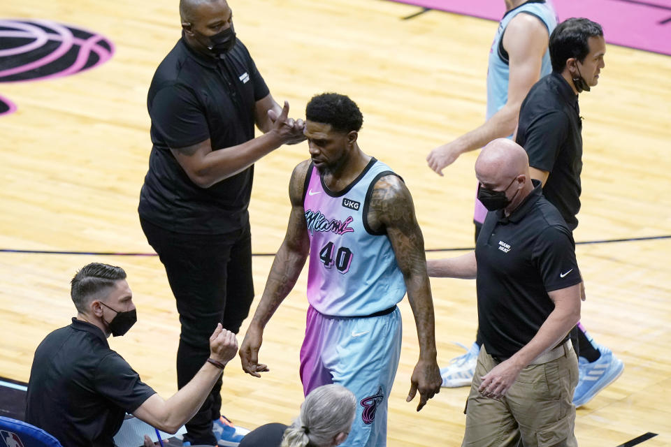 Miami Heat forward Udonis Haslem (40) is escorted off the court after being charged with a technical foul during the first half of the team's NBA basketball game against the Philadelphia 76ers, Thursday, May 13, 2021, in Miami. (AP Photo/Lynne Sladky)