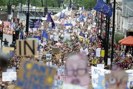 People hold banners during a demonstration against Britain's decision to leave the European Union, in central London, Britain July 2, 2016. Britain voted to leave the European Union in the EU Brexit referendum. REUTERS/Paul Hackett