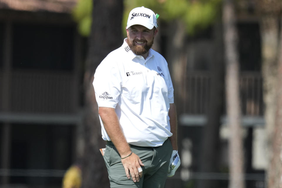 Shane Lowry of Ireland smiles after hitting onto the green from the edge of the third fairway during the final round of the Honda Classic golf tournament, Sunday, Feb. 26, 2023, in Palm Beach Gardens, Fla. (AP Photo/Lynne Sladky)