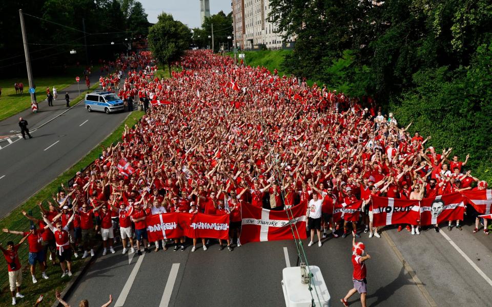 Denmark fans gather in Dortmund to march to the stadium before the match