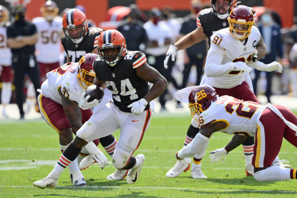 Cleveland Browns running back Nick Chubb (24) rushes for a 16-yard touchdown during the first half of an NFL football game against the Washington Football Team, Sunday, Sept. 27, 2020, in Cleveland. (AP Photo/David Richard)