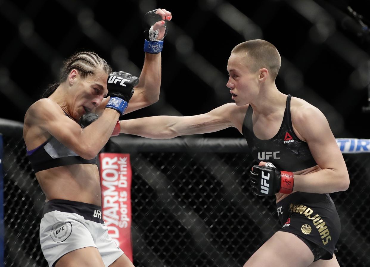 Rose Namajunas (R) punches Poland’s Joanna Jedrzejczyk during the first round of a women’s strawweight title bout at UFC 223 early Sunday, April 8, 2018, in New York. Namajunas won the fight. (AP Photo/Frank Franklin II)