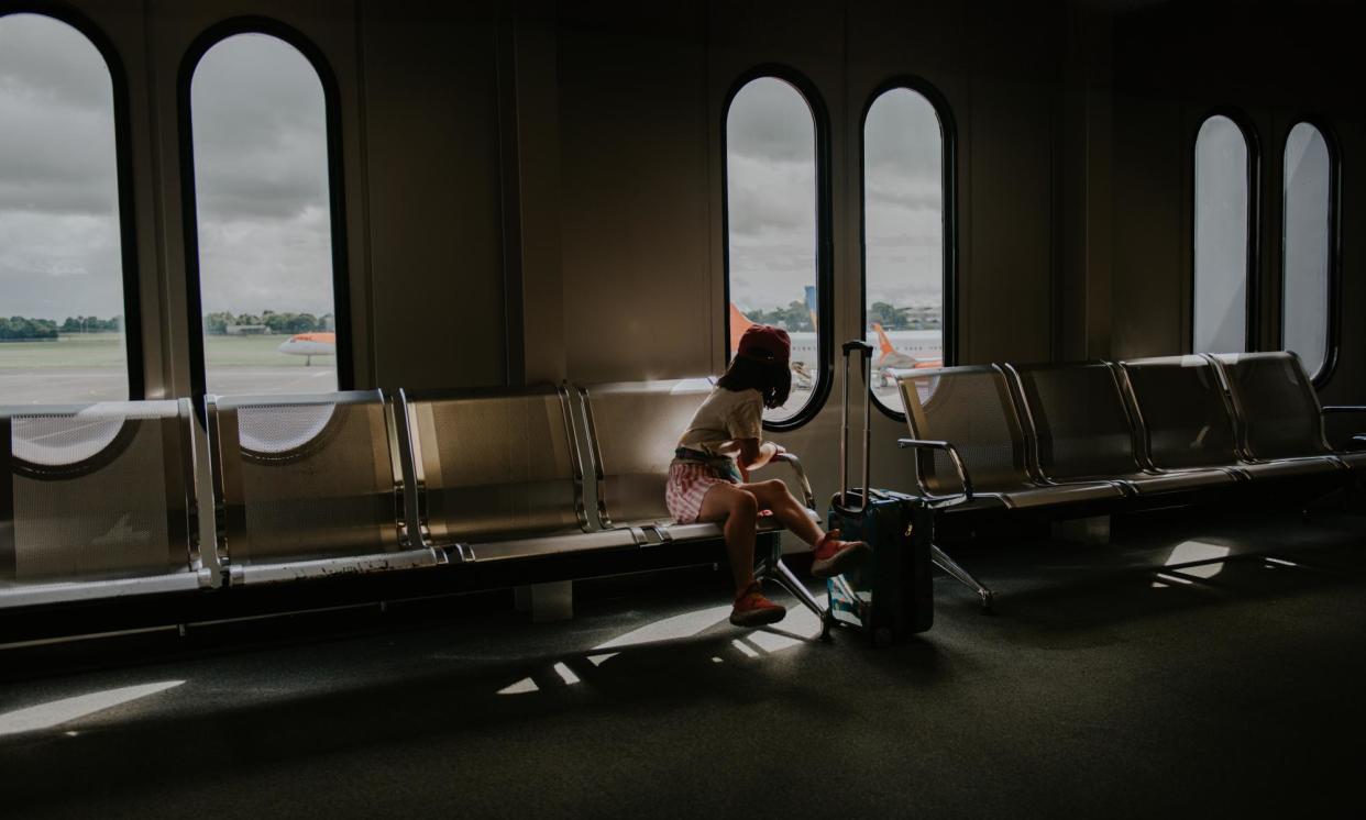 <span>‘You’re at the airport waiting for your flight to board. Even though Group 4 isn’t going to be called for 20 more minutes, you hover near the gate, holding your heavy duffel and suitcase. This is a classic case of precrastination.’</span><span>Photograph: Catherine Falls Commercial/Getty Images</span>