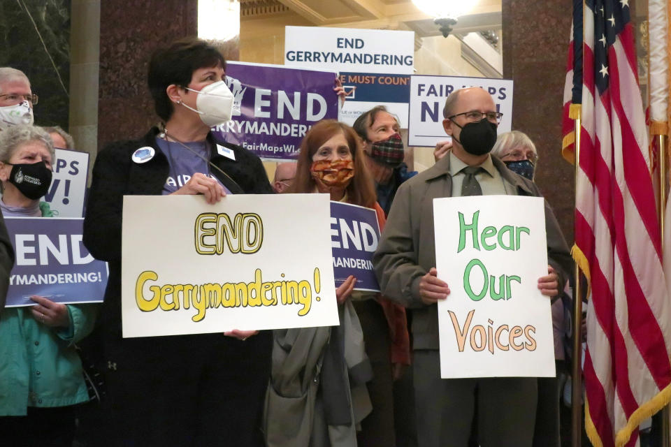 FILE - More than 100 opponents of the Republican redistricting plans vow to fight the maps at a rally ahead of a joint legislative committee hearing in the Wisconsin state Capitol in Madison, Wis. on Thursday, Oct. 28, 2021. In overturning a half-century of nationwide legal protection for abortion, the U.S. Supreme Court ruled that Roe v. Wade had been wrongly decided and that it was time to “return the issue of abortion to the people's elected representatives” in the states. But some question whether gerrymandering has diminished the ability of state legislatures to truly represent the people's will. (AP Photo/Scott Bauer, File)