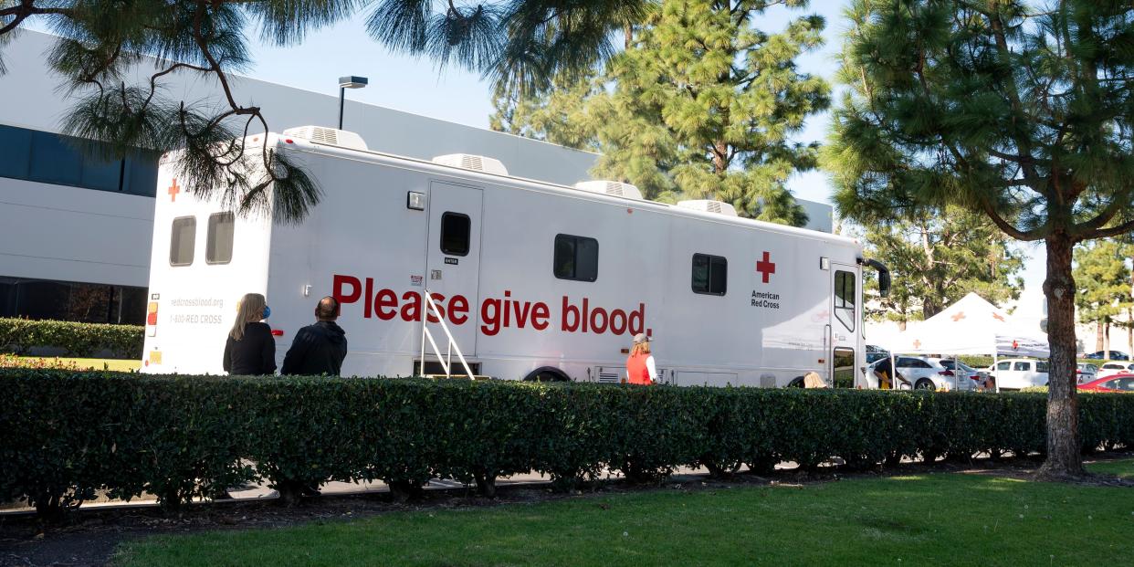 An American Red Cross bloodmobile is parked.