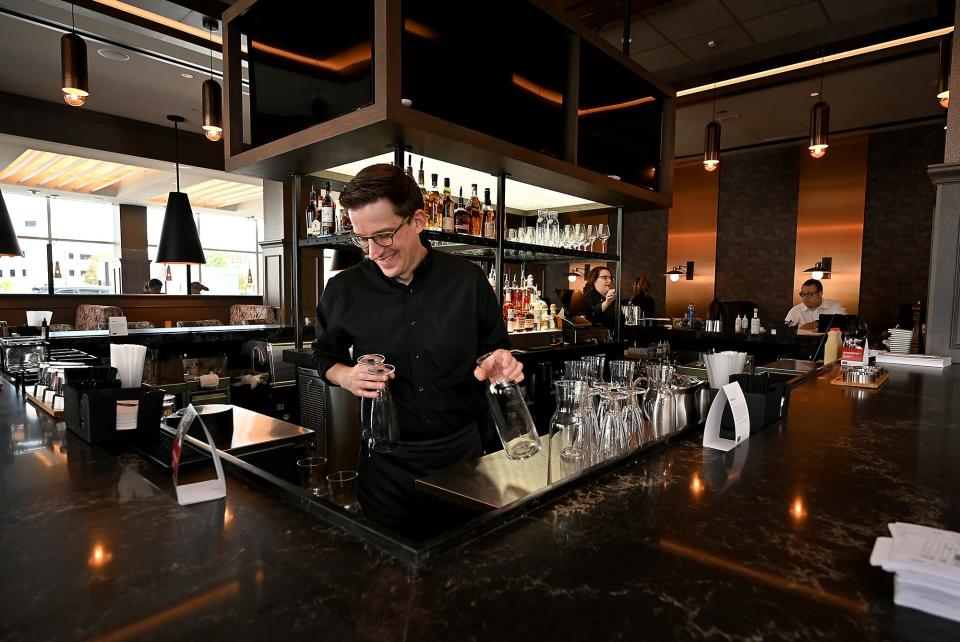 Ruth's Chris Steak House bartending coach Ian Howell gets the bar ready.