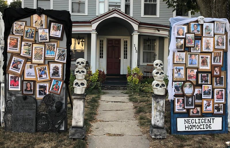 The "Halloween House" displays photos of people who have died from COVID-19 or at the hands of police. (Photo: Matt Warshauer)