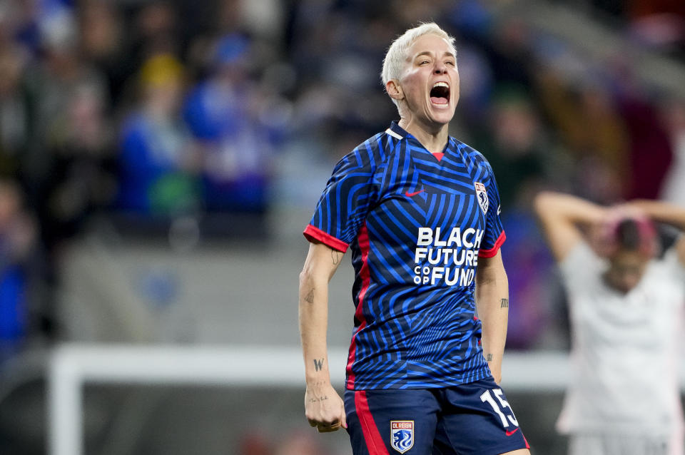 OL Reign forward Megan Rapinoe reacts after a goal by forward Veronica Latsko against Angel City FC during the second half of an NWSL quarterfinal playoff soccer match Friday, Oct. 20, 2023, in Seattle. OL Reign won 1-0. (AP Photo/Lindsey Wasson)