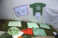 <p>Messages left by fans are part of a makeshift memorial for members of the Chapecoense soccer team outside the Arena Conda stadium in Chapeco, Brazil, Tuesday, Nov. 29, 2016. A chartered plane that was carrying the Brazilian soccer team to the biggest match of its history crashed into a Colombian hillside and broke into pieces, Colombian officials said Tuesday. (AP Photo/Andre Penner) </p>