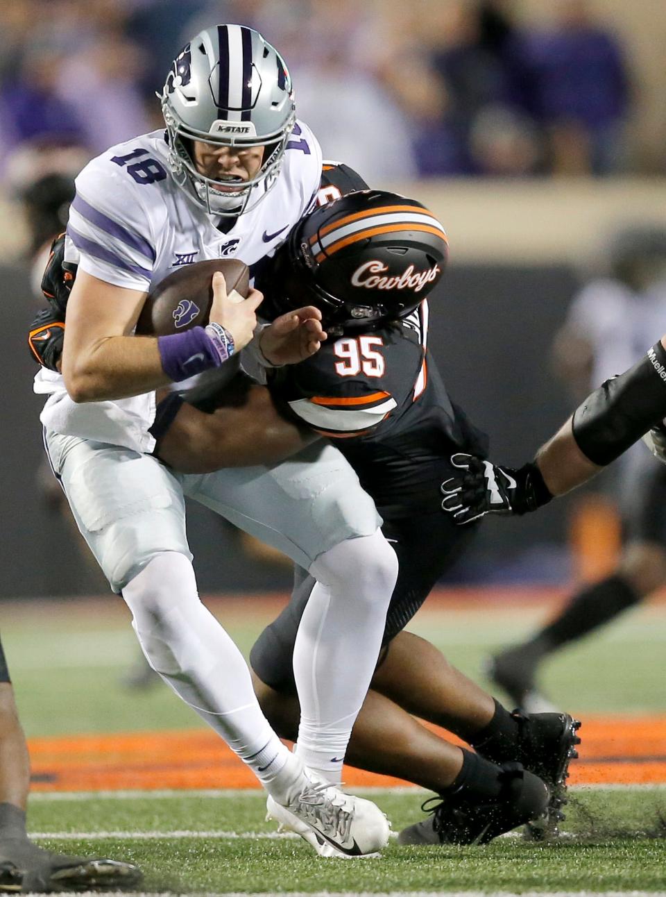 Oklahoma State's Jaleel Johnson (95) sacks Kansas State quarterback Will Howard (18) in the first half of their game Friday night at Boone Pickens Stadium.