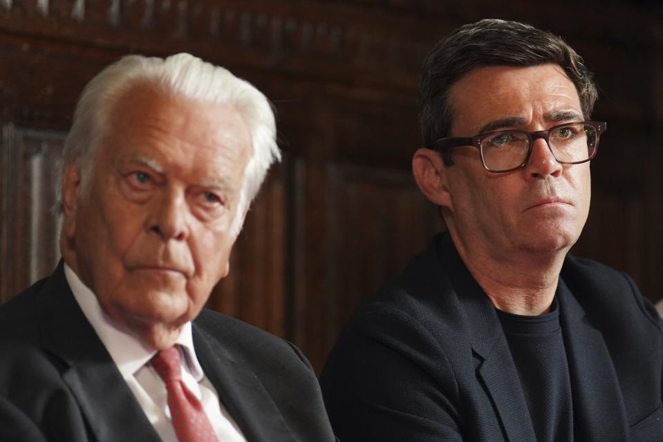 Britain's former health minister David Owen and former health secretary and Mayor of Manchester Andy Burnham listen, during a press conference at Church House in Westminster, after the publication of the Infected Blood Inquiry report, in London, Monday, May 20, 2024. An inquiry has found that British authorities and the public health service knowingly exposed tens of thousands of patients to deadly infections through contaminated blood and blood products and hid the truth about the disaster for decades. (Stefan Rousseau/PA via AP)