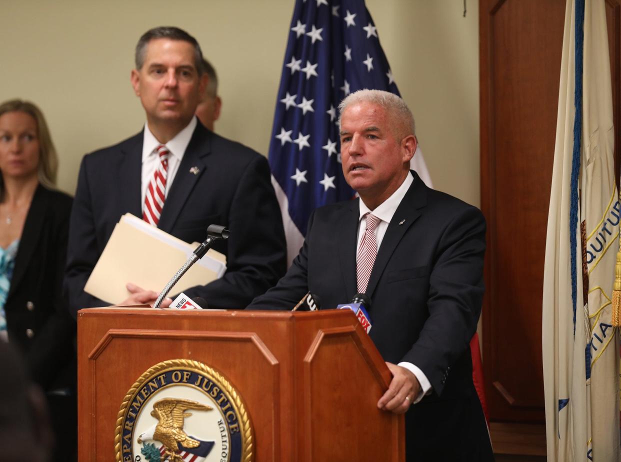 Former U. S. Attorney James P. Kennedy, Jr. announcing the guilty plea by Perry Santillo, of Rochester who bilked at least 1,000 people out of more than $100 million over a decade.