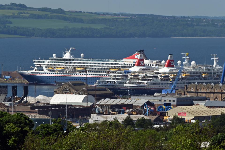 ROSYTH, SCOTLAND - JUNE 01: The Fred Olsen Cruise Lines ships Balmoral, Black Watch, and Boudicca, in Rosyth Basin where they will be laid up with their sister ship Braemar during the Covid-19 pandemic, on June 1, 2020 in Rosyth, Scotland. The four Fred Olsen ships Braemar, Balmoral, Black Watch and Boudicca have been anchored in the Firth of Forth as the cruise industry slumped as a result of the Covid-19 pandemic, but have now been moved to the Babcock facility at Rosyth where the aircraft carriers HMS Queen Elizabeth and HMS Prince of Wales were built. (Photo by Ken Jack/Getty Images)