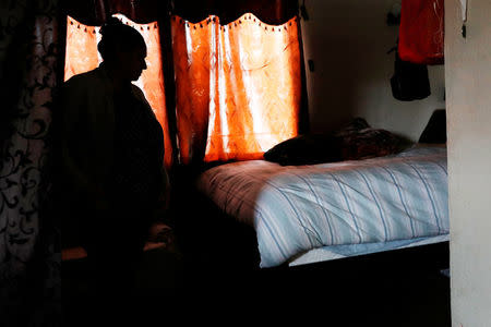Sandra Gutierrez, who fled from gang violence in Honduras with her family and was granted asylum by the United States in 2016, is seen in a makeshift bedroom inside her home in Oakland, California, U.S., May 30, 2017. Picture taken May 30, 2017. REUTERS/Stephen Lam