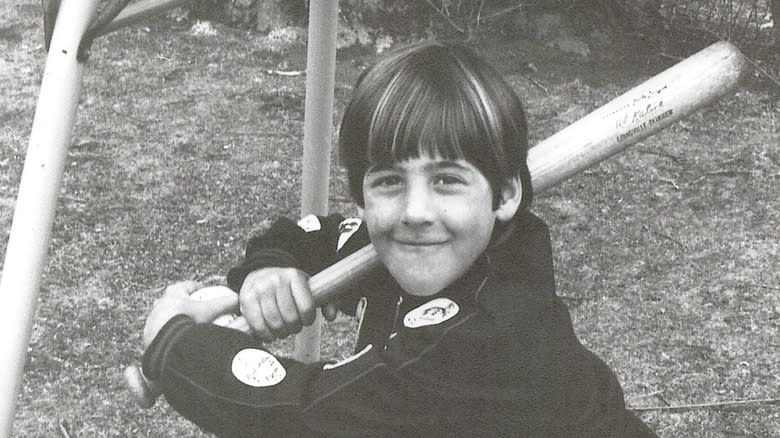 Young Andrew Zimmern with baseball bat