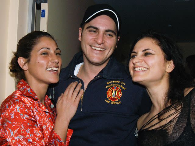 <p>Richard Corkery/NY Daily News Archive/Getty</p> Joaquin Phoenix with his sisters Summer Phoenix and Rain Phoenix.