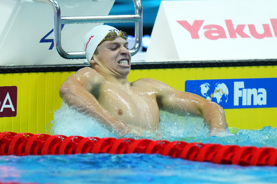 Leon Marchand of France celebrates after finishing first during the men's 400m medley final at the 19th FINA World Championships in Budapest, Hungary, Saturday, June 18, 2022. (AP Photo/Petr David Josek)