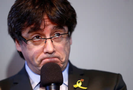 FILE PHOTO: Catalonia's former leader Carles Puigdemont reacts during a news conference in Berlin, Germany, April 7, 2018. REUTERS/Hannibal Hanschke/File Photo