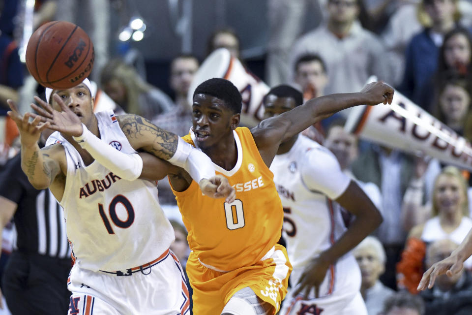 Auburn guard Samir Doughty (10) and Tennessee guard Davonte Gaines (0) chase down the ball during the first half of an NCAA college basketball game Saturday, Feb. 22, 2020, in Auburn, Ala. (AP Photo/Julie Bennett)