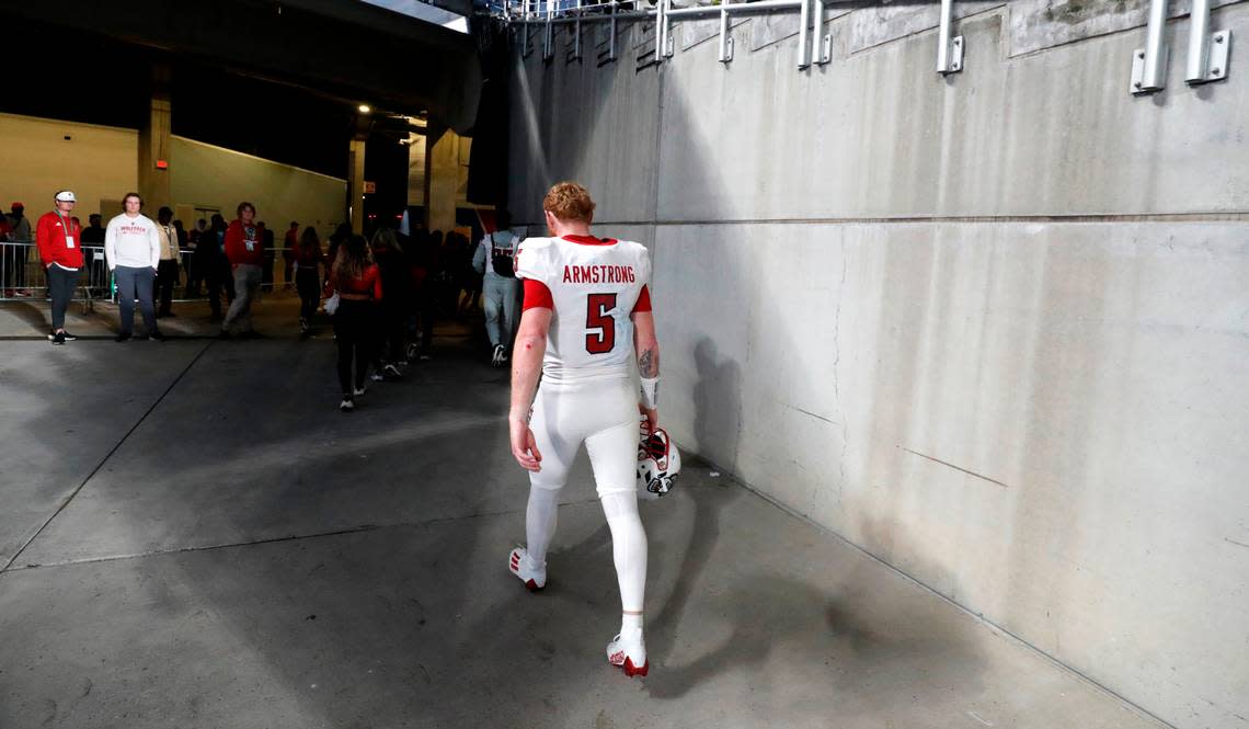 N.C. State quarterback Brennan Armstrong (5) walks off the field after Kansas State’s 28-19 victory over N.C. State in the Pop-Tarts Bowl at Camping World Stadium in Orlando, Fla., Thursday, Dec. 28, 2023. Ethan Hyman/ehyman@newsobserver.com