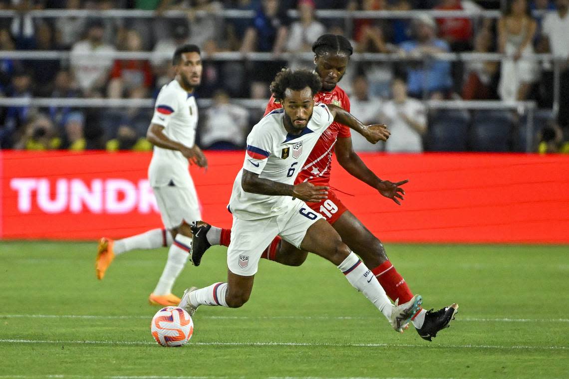 Jun 28, 2023; St. Louis, Missouri, USA; United States midfielder Gianluca Busio (6) and Saint Kitts and Nevis midfielder Romaine Sawyers (19) battle for the ball during the first half at CITYPARK. Mandatory Credit: Jeff Curry-USA TODAY Sports