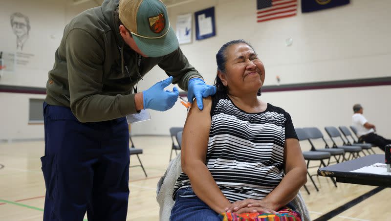 Ana Enriquez gets a Moderna COVID-19 booster shot during a free vaccine clinic at the Sanderson Community Center in Taylorsville on Nov. 9, 2022.