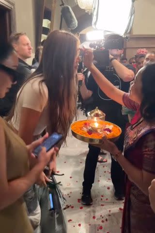 <p>Khloe Kardashian/Instagram</p> Kim and Khloe Kardashian are greeted by hotel staff in Mumbai