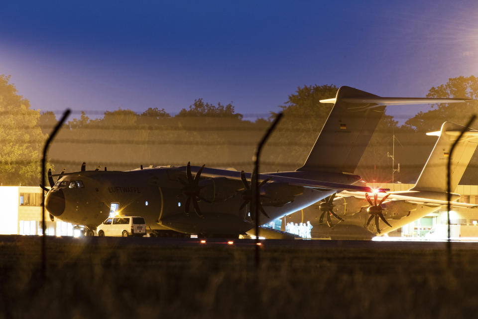 A military transport aircraft, an Airbus A400 M of the German Air Force, stands at the Wunstorf, Germany, air base in Lower Saxony before taking off for Mali, Friday, June 25, 2021. Germany’s defense minister said on Friday that 12 German troops and a soldier from another country were wounded following an attack on soldiers taking part in a United Nations mission in Mali. (Swen Pf'rtner/dpa via AP)