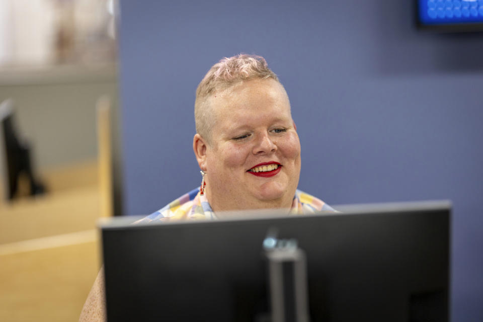 June Meissner poses for a photo at the Boise Public Library in Boise, Idaho on Thursday, June 6, 2024. Meissner, a transgender woman and librarian, blocked a punch from a man yelling slurs while working at the library. (AP Photo/Kyle Green)