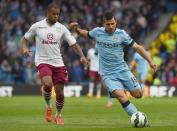 Manchester City's Argentinian striker Sergio Aguero (R) vies with Aston Villa's Dutch midfielder Leandro Bacuna during the English Premier League football match in Manchester, north west England on April 25, 2015