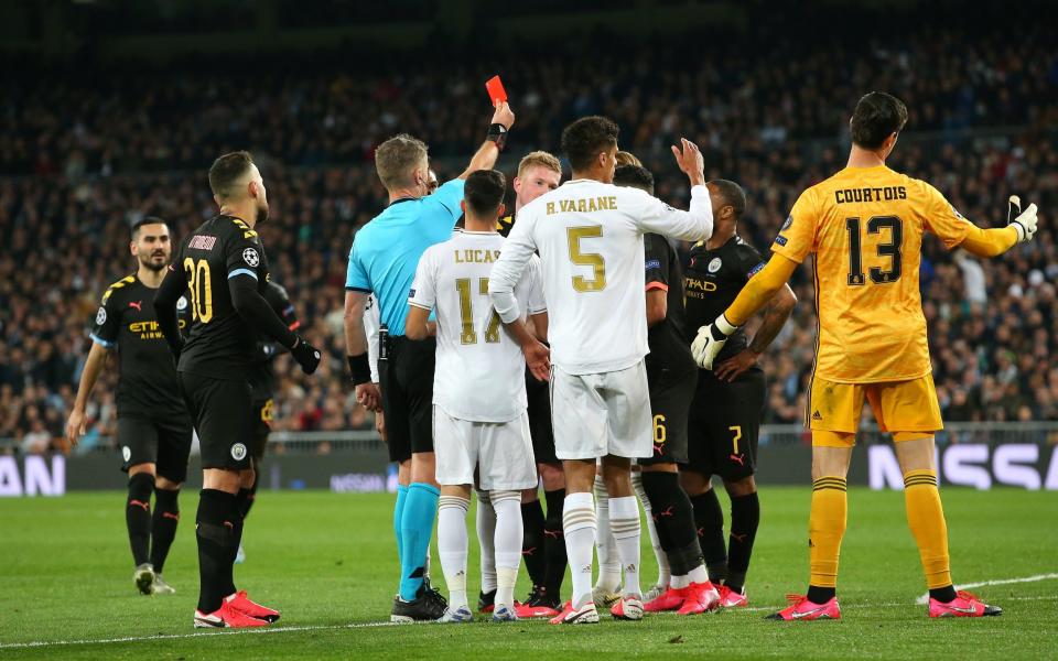 Sergio Ramos of Real Madrid is sent off by referee Daniele Orsato during the UEFA Champions League round of 16 first leg match between Real Madrid and Manchester City at Bernabeu on February 26, 2020 in Madrid, Spain.  - GETTY IMAGES