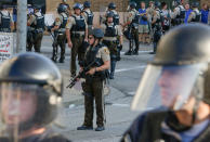 <p>St. Louis Police Department officers stand on the street in riot gear after a not guilty verdict in the murder trial of Jason Stockley, a former St. Louis police officer, charged with the 2011 shooting of Anthony Lamar Smith, who was black, in St. Louis, Mo., Sept. 15, 2017. (Photo: Lawrence Bryant/Reuters) </p>