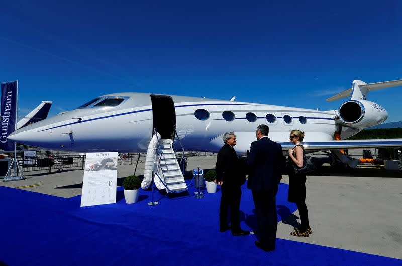 FILE PHOTO: People stand in front of G500 Gulfstream aircraft during EBACE in Geneva