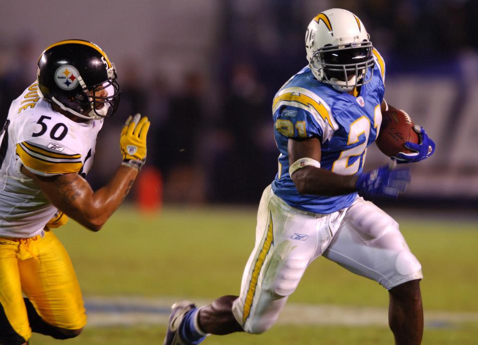 San Diego Chargers running back LaDainian Tomlinson tries to elude Pittsburgh Steelers linebacker Larry Foote during 24-22 loss in Monday Night Football game at Qualcomm Stadium in San Diego, Calif. on October 10, 2005. (Photo by Kirby Lee/NFLPhotoLibrary)