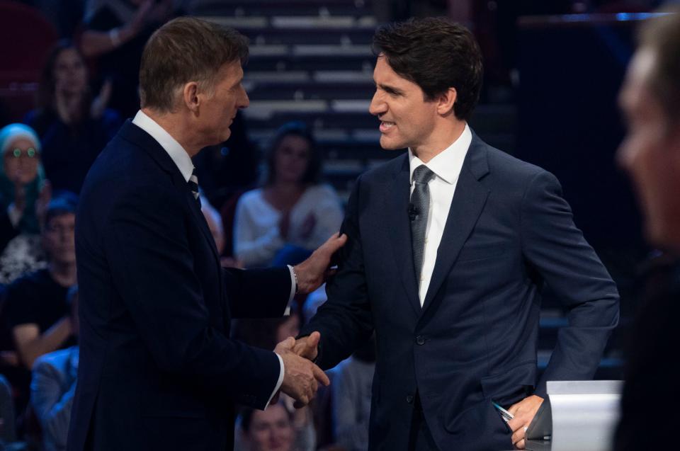 People's Party of Canada leader Maxime Bernier (L) and Canada's Prime Minister and Liberal leader Justin Trudeau shake hands following the Federal leaders French language debate at the Canadian Museum of History in Gatineau, Quebec on October 10, 2019. (Photo by Adrian Wyld / POOL / AFP) (Photo by ADRIAN WYLD/POOL/AFP via Getty Images)