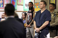 Stephen Alo, 46, left, and Russell Smith, 26, make initial court appearances in Henderson Justice Court Thursday, June 2, 2022, in Henderson, Nev. They are suspects in a shooting between Hells Angels and rival Vagos bikers on Sunday on U.S. Highway 95 according to police. (K.M. Cannon/Las Vegas Review-Journal via AP)