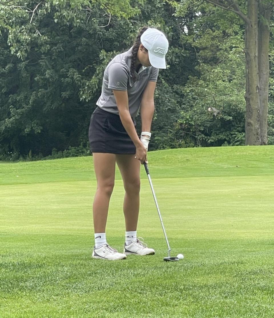 Alaina Willie of St. Mary Catholic Central putts during the Airport Match-Play Tournament at Sandy Creek Monday. SMCC too second to Woodhaven.