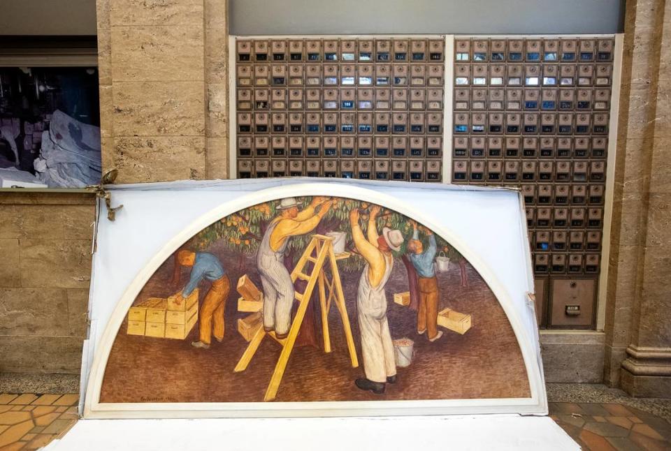 “Fruit Picking” by Ray Boynton was returned to the El Viejo Building, the former downtown Post Office, in Modesto, Calif., on Friday, July 22, 2022. The paintings had been removed during a remodel in 1967.