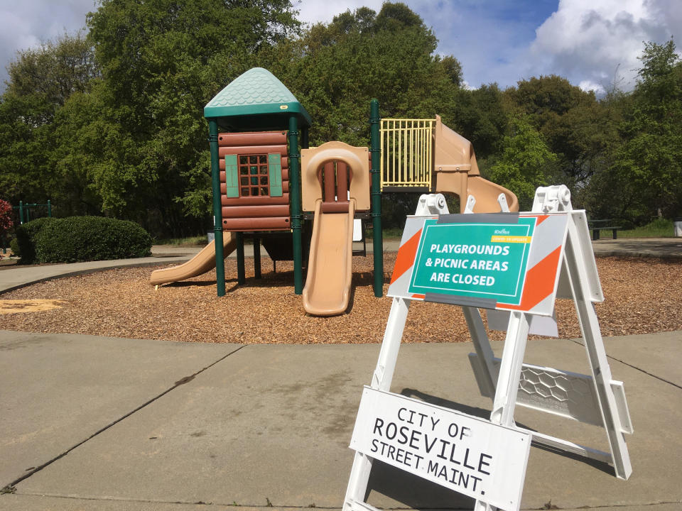 Closed playgrounds and picnic areas are seen closed amid the global coronavirus pandemic outbreak, in Roseville, Calif., on Sunday, March 29, 2020. Californians endured a weekend of stepped-up restrictions aimed at keeping them home as much as possible while hospitals and health officials scrambled Sunday to ready themselves for a week that could see the feared dramatic surge in coronavirus cases. The government's top infectious-disease expert warned Sunday that the coronavirus outbreak could kill 100,000 to 200,000 Americans as smoldering hotspots in nursing homes and a growing list of stricken cities heightened the sense of dread across the country. (AP Photo/Don Thompson)