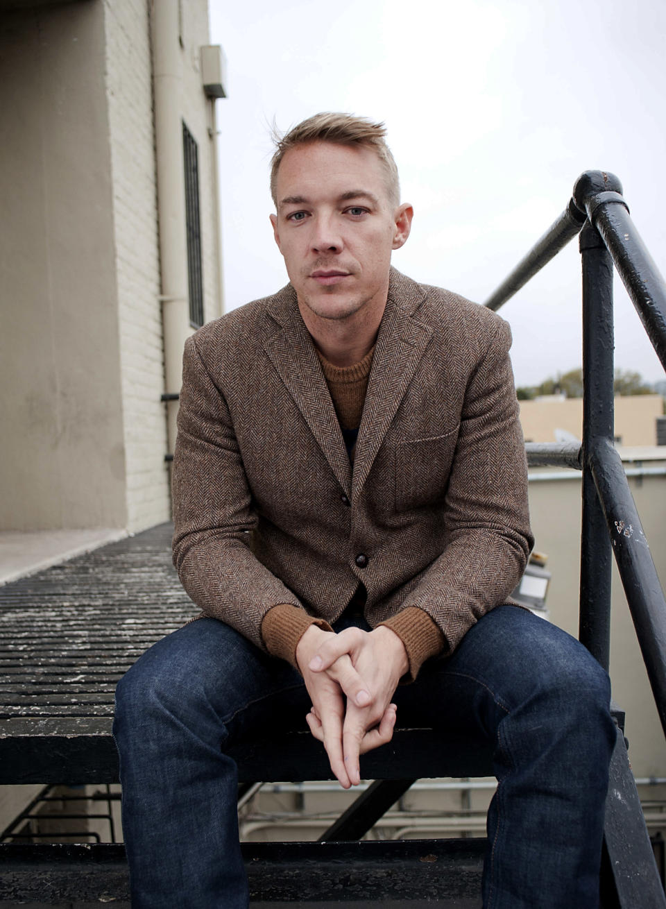 DJ and music producer Diplo poses for a portrait at the Mad Decent Studios on Thursday, Feb. 7, 2013 in Los Angeles. (Photo by Dan Steinberg/Invision/AP)