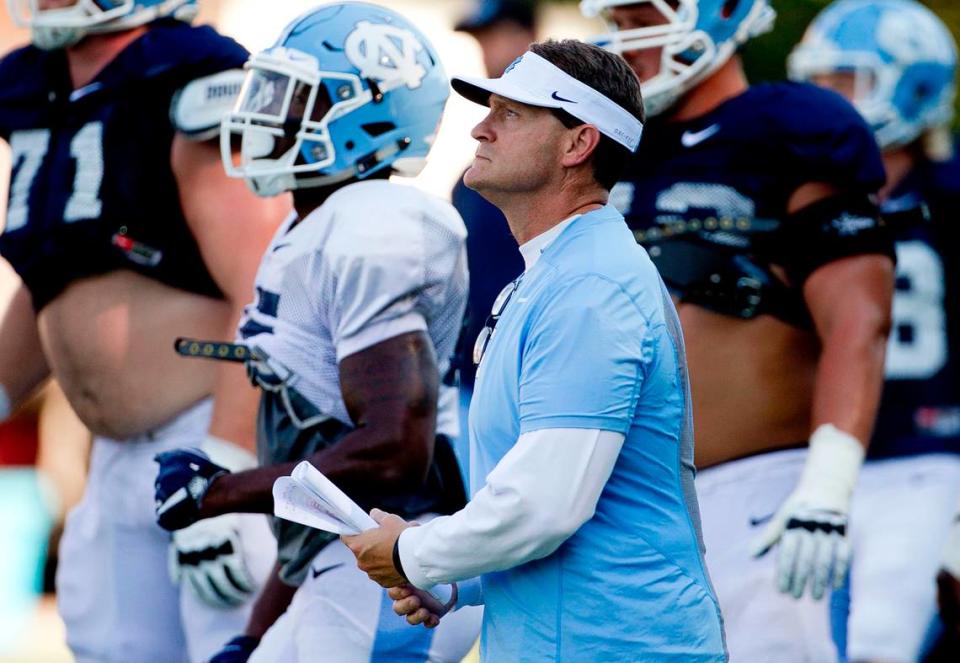 North Carolina defensive coordinator Gene Chizik works with his players during practice on Tuesday, September 6, 2016 at Navy Field in Chapel Hill, N.C. Chizik said the Tar Heels’ run defense needs to improve as they prepare for their next game against Illinois.