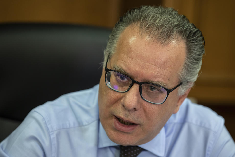 Alternate Minister for immigration policy in the ministry of Citizen's Protection of Greece, George Koumoutsakos speaks to the Associated Press during an interview, in Athens, on Friday, Sept. 27, 2019. Authorities in Greece say seven people have died Friday after a boat carrying migrants sank in the eastern Aegean Sea. (AP Photo/ Petros Giannakouris)