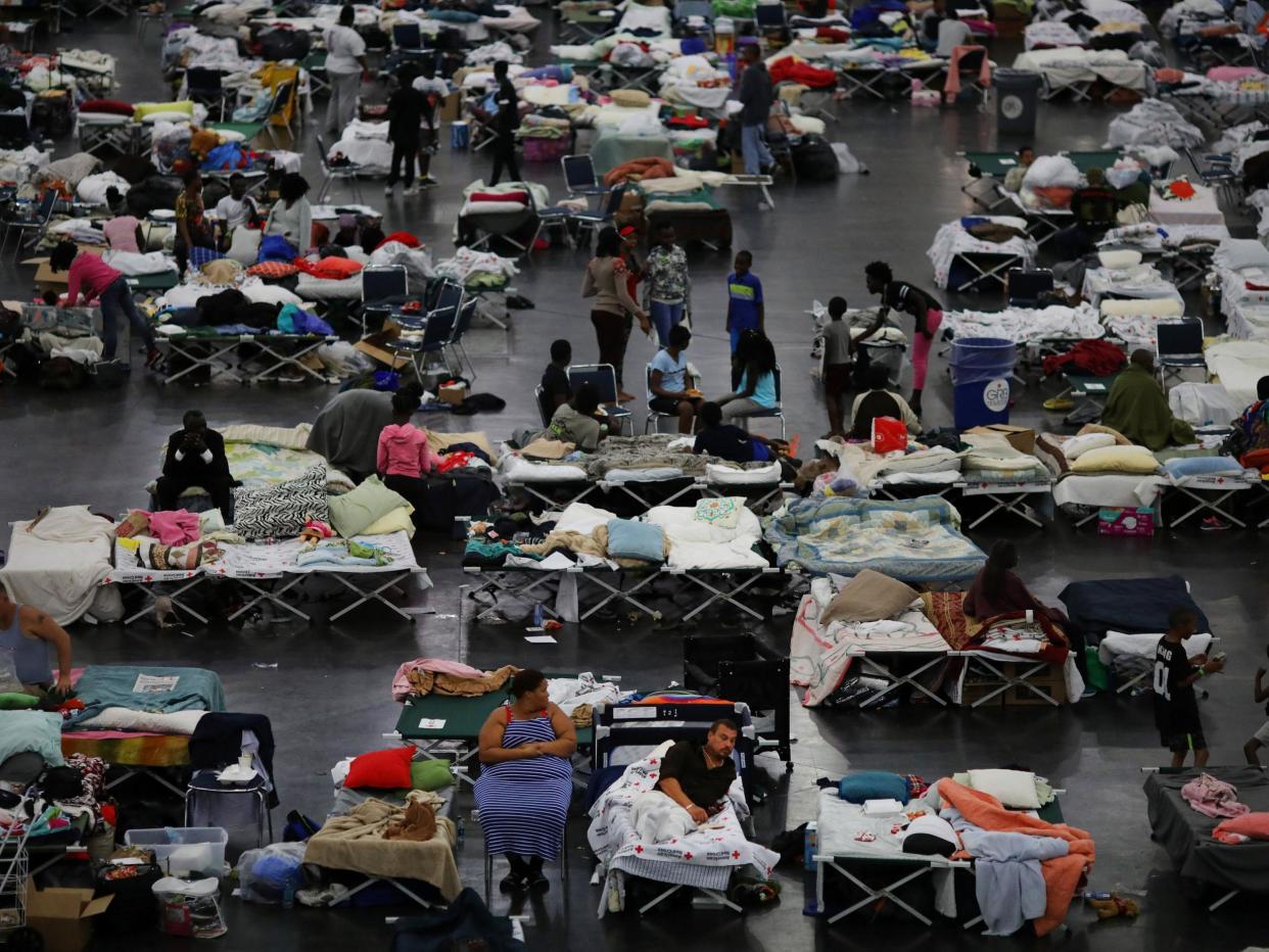 Evacuees affected by Tropical Storm Harvey take shelter at the George R Brown Convention Center in downtown Houston: Carlos Barria / Reuters