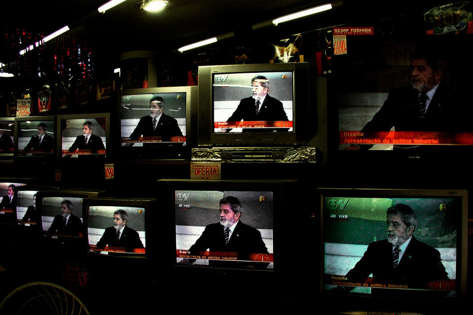 Inside a shop in São Paulo in 2004, Lula is seen on television giving a speech responding to accusations of corruption against his government.<span class="copyright">Alex Majoli—Magnum Photos</span>