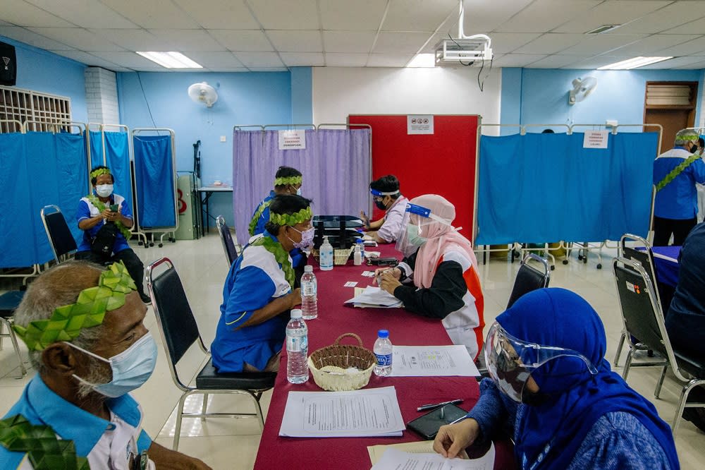 People from the Orang Asli community receive the first dose of the Covid-19 vaccine in Gombak June 19, 2021. ― Picture by Firdaus Latif