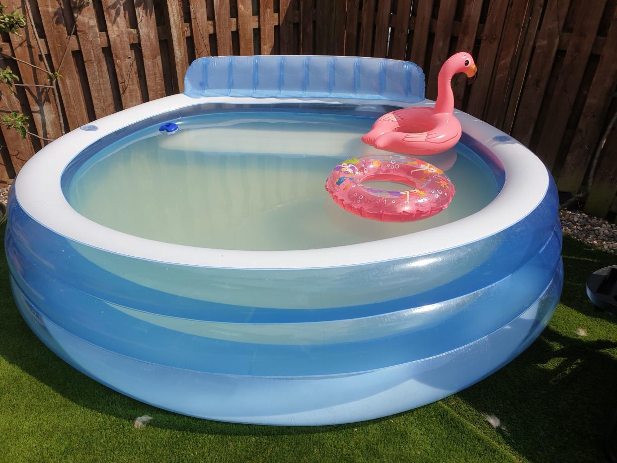 Cloudy pool with pink flamingos floats and pink mermaid ring
